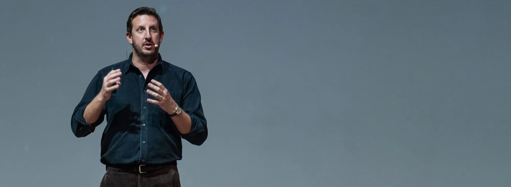Zack Kass speaking on stage